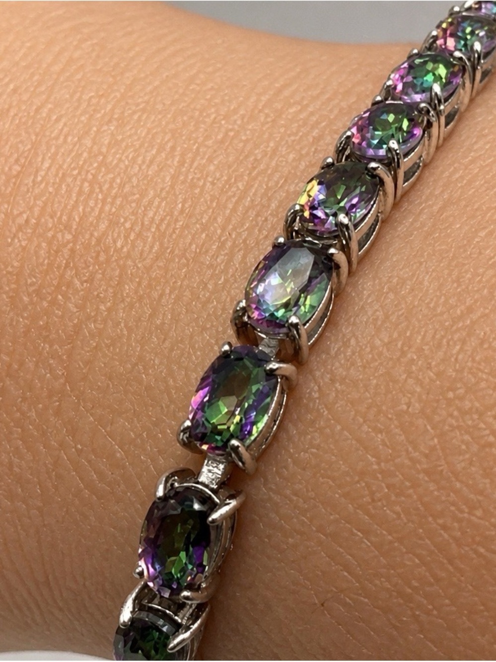 High end mystic quartz tennis bracelet set in rhodium over S925.